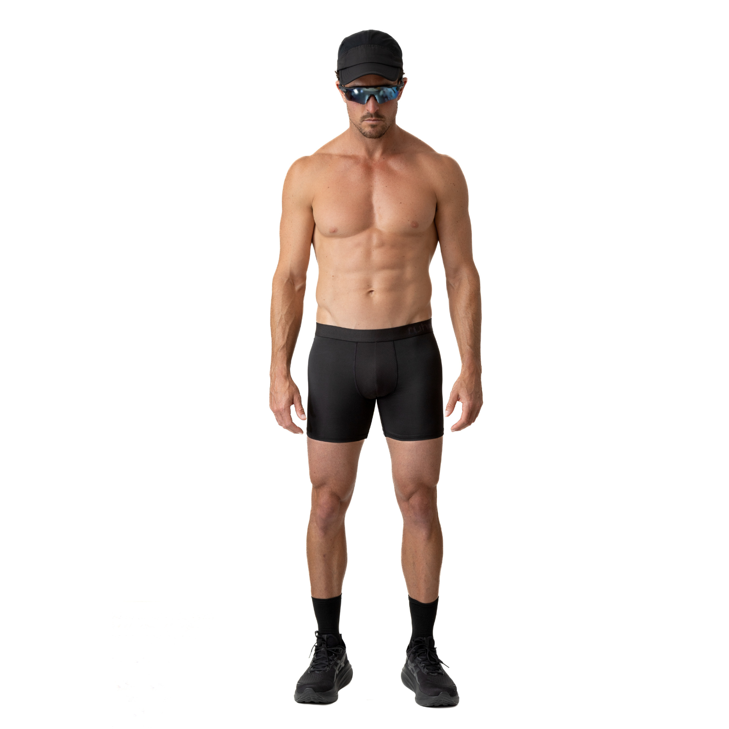 Front view of a person wearing ruhn performance underwear in Activated Black against a white background