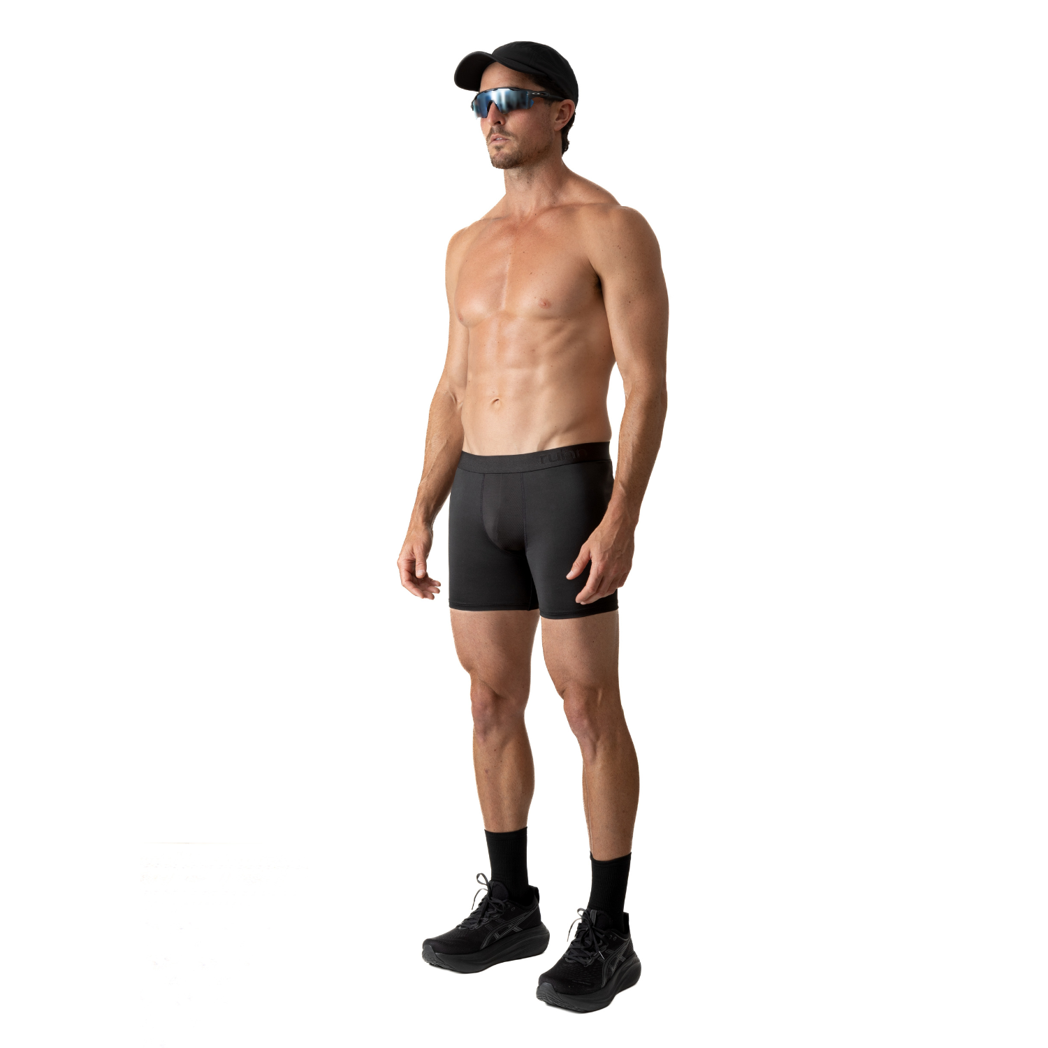 Side view of a person wearing ruhn performance underwear in Activated Black against a white background