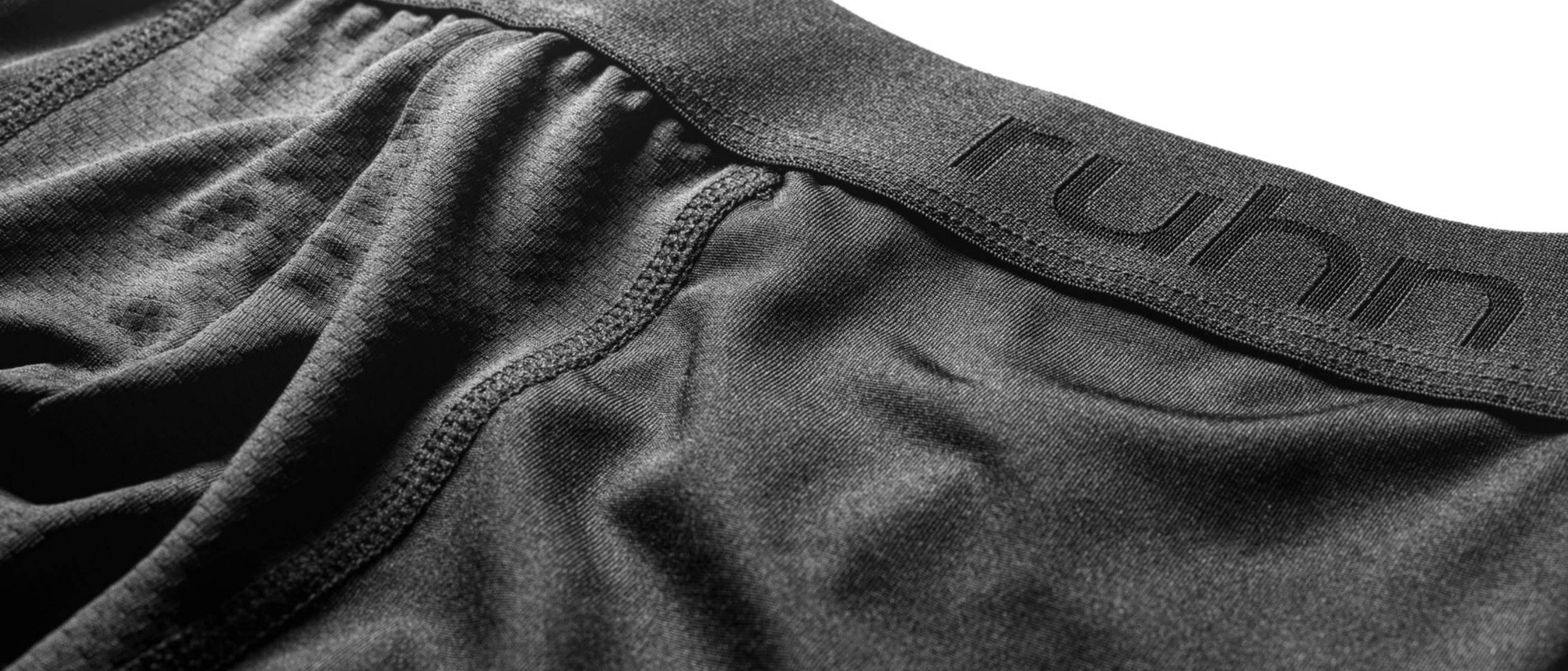 Close-up of ruhn black performance underwear showing waistband detail and textured moisture-wicking fabric
